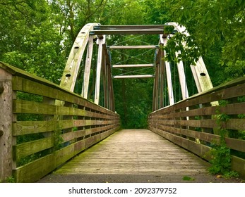 Wooden walk across bridge going over a small stream at my local park in Milwaukee Wisconsin￼
