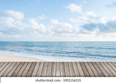 Wooden walkway with beautiful white sand beach ocean and clear blue sky background, space for product or object presentation