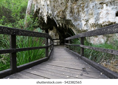 A Wooden Walkway Leads Into The Entrance Of Mammoth Cave In Margaret River, Australia.