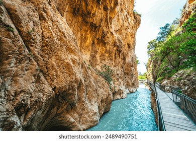 Wooden walkway suspension bridge (suspension bridge) with steel cable. Antalya Goynuk Canyon. Natural rocky canyon with clear blue water in Goynuk, Turkey - Powered by Shutterstock