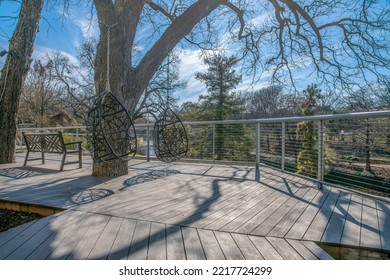 Wooden Walkway With Swings And Bench At The San Antonio River Walk In Texas. A Relaxing Park Area Where People Can Sit And Enjoy The Scenic Nature Views On A Sunny Day.