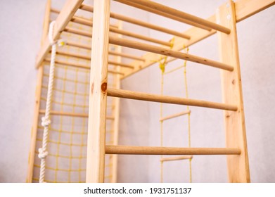 Wooden Wall Bars Ladder In Big Empty Gym Room Of School No People