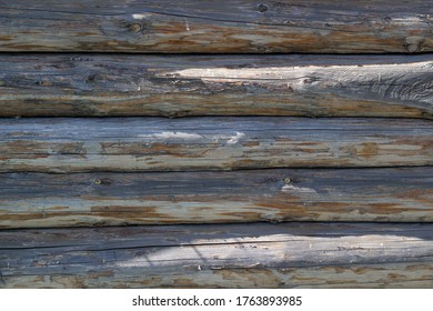 Wooden wall from logs. Horizontal background texture