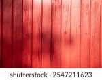 wooden wall red wood house made of line plank boards vertically background texture