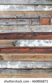 Wooden Wall Of Shabby Old Slats With Flaking Wood Color For Background; Wooden Fence Of A Construction Site; Temporary Visual Protection