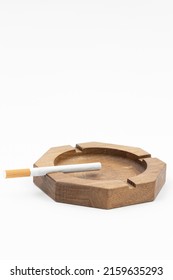 Wooden Walnut Ashtray Isolated Above White Background With Copy Space.