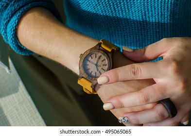 
wooden watch on the hand - Shutterstock ID 495065065