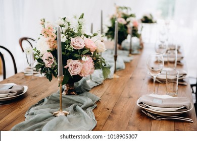 Wooden Wedding Table Decoration With Flowers And Candles