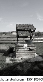 A Wooden Well With A Basin And A Towel. Against The Background Of Carpathian Nature.