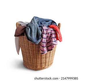 Wooden wicker basket that holds lots of used clothes and prepares them for washing. isolated on white background.