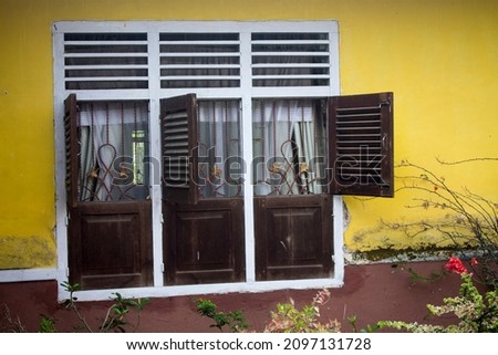 wooden window with a classic model in a country house