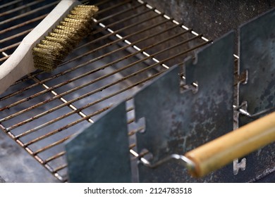 Wooden Wire Brush For Cleaning Dirty Barbecue Grill.