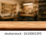 Wooden Workbench Table in Workshop Background. Empty Wood Surface for Product Display, Carpentry, DIY, Hand Tools, Garage, Industrial, Blurred Background, Rustic, Craftsmanship. For display or montage