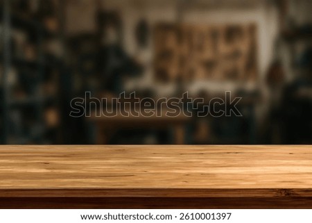 Wooden Workbench Table in Workshop Background. Empty Wood Surface for Product Display, Carpentry, DIY, Hand Tools, Garage, Industrial, Blurred Background, Rustic, Craftsmanship. For display or montage
