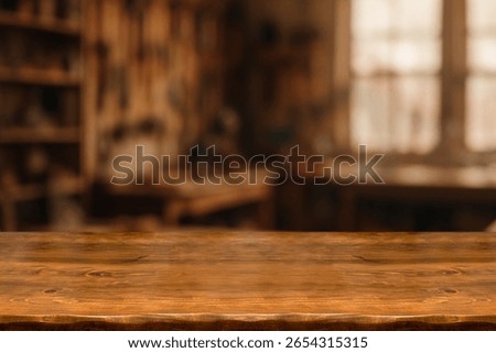 Wooden Workbench Table in Workshop Background. Empty Wood Surface for Product Display, Carpentry, DIY, Hand Tools, Garage, Industrial, Blurred Background, Rustic, Craftsmanship. For display or montage