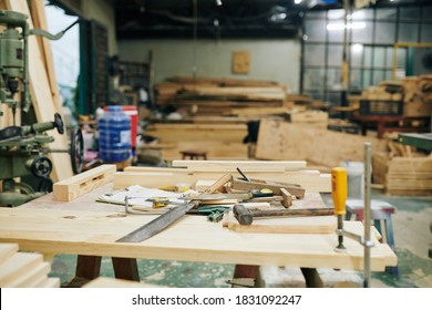 Wooden Workbench With Various Tools In Carpentry Shop