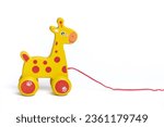 Wooden yellow horse on wheels isolated on white background Educational children