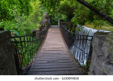 Wooden-based Chain Bridge That Crosses A Waterfall Within A Lush Forest,  Baofeng Lake In Suoxi Valley, Wulingyuan - Zhangjiajie Area, China
