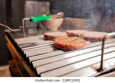 Wood-fired Grill Cooking Beef Burgers