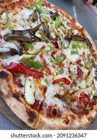 Wood-fired Pizza With Vegetables And Thin Crust