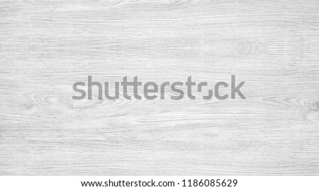 Woodgrain of ash tree, light gray wood texture background,  wooden table with nature color, grain and pattern. Top view of grey wood surface, plywood panel or veneer for backdrop, abstract wallpaper.