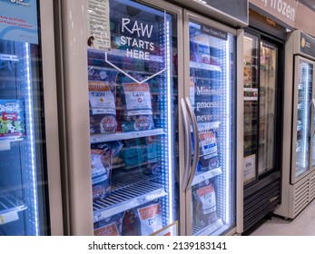 Woodinville, WA USA - circa February 2022: Angled view of refrigerated Instinct Raw dog and cat food inside a Petsmart pet supply store.