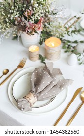 Woodland Festive Table Decor With Candles And Golden Cutlery. Spring Holidays Concept.