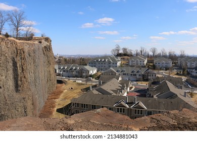 Woodland Park, New Jersey, USA - February 26, 2022: A Large Cliff Overlooking The Four Seasons Great Notch Condominium Complex