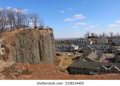 Woodland Park, New Jersey, USA - February 26, 2022: View Of A Cliff And The Four Seasons Great Notch Condominium Complex From Rifle Camp Park