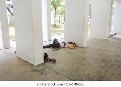 Woodlands / Singapore - April 22nd 2019: Foreign Workers Are Taking A Nap During Break Time At The Void Deck.