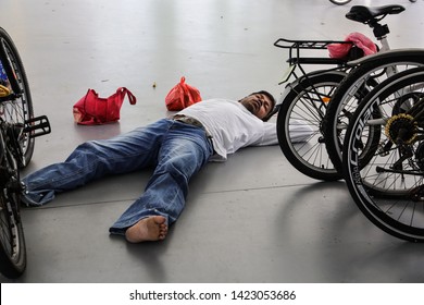 Woodlands / Singapore - June 13th 2019: Foreign Worker Are Taking A Nap At The Void Deck Area.