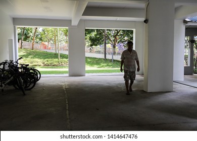 Woodlands / Singapore - June 2nd 2019: A Man Is Walking At The Void Deck Area In The Housing Estate.