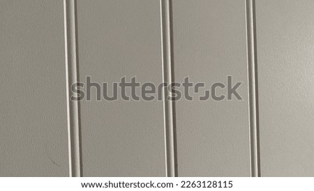 Woodpanel basic linepattern in white on a wall 