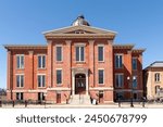 Woodstock, Illinois - United States - April 8th, 2024: Exterior of the historical Old McHenry County Courthouse, built in 1857, in Woodstock, Illinois, USA.