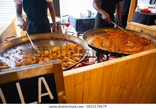 Woodstock, The Old Biscuit Mill, Neighbourgoods\
Market -  Cape Town, South Africa - 11/14/20\
\
Chicken and seafood\
stir-fry dishes. Being prepared on giant cooking woks. Tasty smells\
fill the market.\
