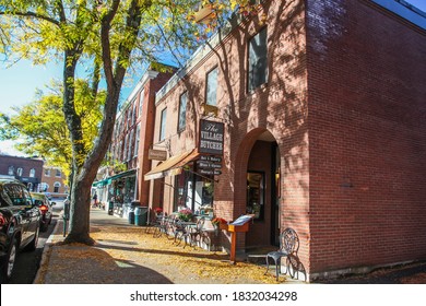 WOODSTOCK, VT, USA - OCTOBER 9, 2020: The Village Butcher shop storefront with morning autumn lights