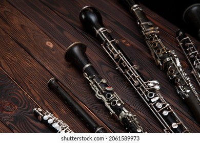 Woodwind Instruments On A Wooden Surface