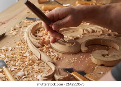 Woodwork And Wood Carving. Carpenter's Hands Use Chiesel. Senior Wood Carving Professional During Work. Man Working With Woodcarving Instruments