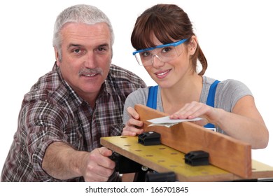 Woodworker and female apprentice