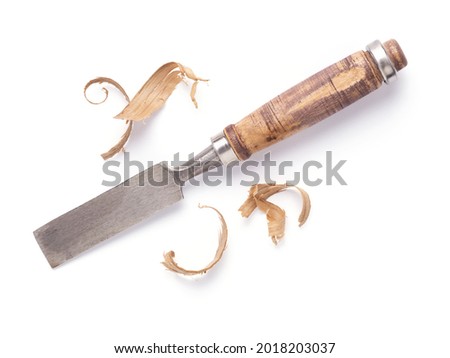 Woodworking carpenter chisel tool and wooden shavings isolated on white background. Chisel as joiner tool