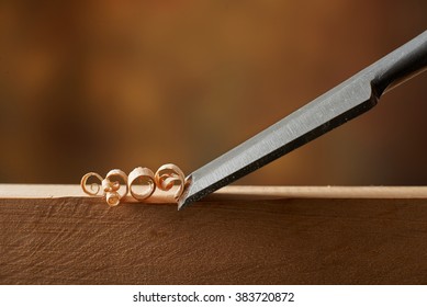 Woodworking tool. Carving wood with a chisel - Shutterstock ID 383720872