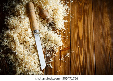 Woodworking tools. Chisel with sawdust .