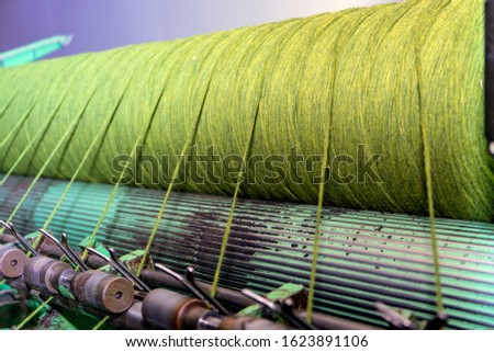 Wool bobbin making machine. Traditional woolen factory