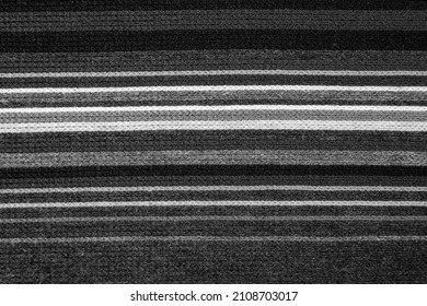 Wool fabric knitted with horizontal lines in monochrome.
