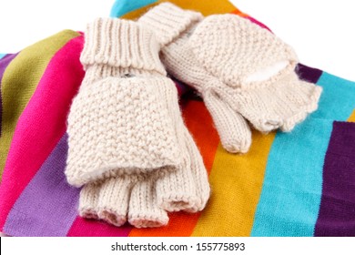 Wool fingerless gloves and multicolor scarf, isolated on white