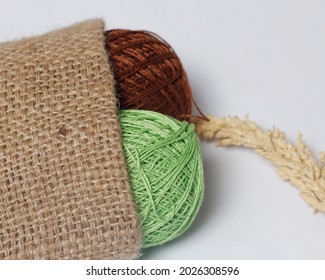 Wool thread isolated on bright background. Wool yarn is a yarn with a soft texture. Usually used for the main material for making knitting crafts such as clothes and hats. Focus blur. - Powered by Shutterstock