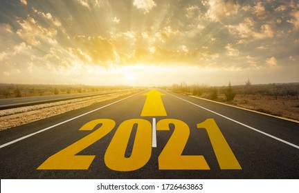 The word 2021 written on highway road. Concept for new year 2021