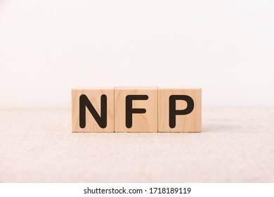 Word Acronym NFP As Not For Profit Is Made Of Wooden Building Blocks. Concept.