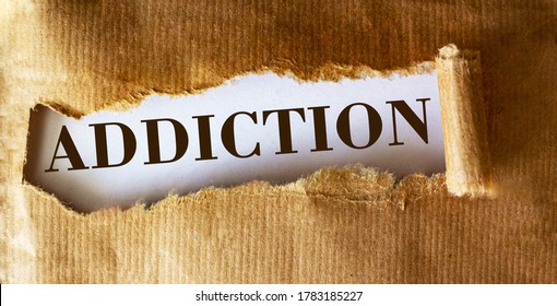 The word Addiction is written underneath brown torn paper.