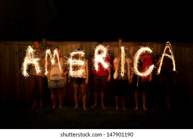 The Word America In Sparklers As Part Of Independence Day (July 4th) Celebration